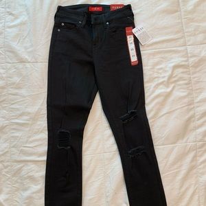 Calvin Klein Jeans. New, never worn. Size 25 black